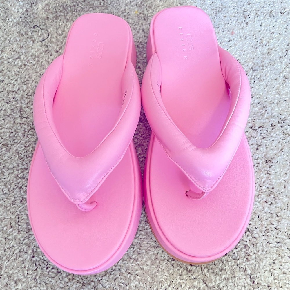 Pink thong platform sandals.